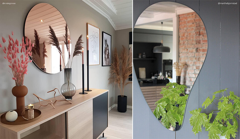 Okroglo ogledalo v rožnato zlati barvi na sivi steni - kapljičasto ogledalo na sivi steni